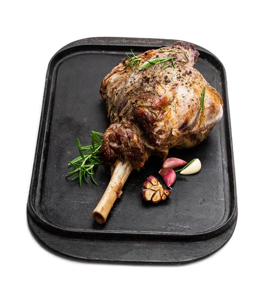 Whole roast lamb leg on grill tray isolated on white — Stock Photo, Image