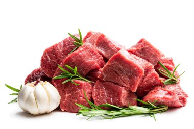 Sliced raw beef with rosemary herb and garlic isolated on white  clipart