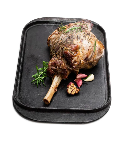 Whole roast lamb leg on grill tray isolated on white — Stock Photo, Image