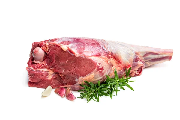 Fresh raw lamb leg with rosemary leaves and garlic isolated on white — Stock Photo, Image