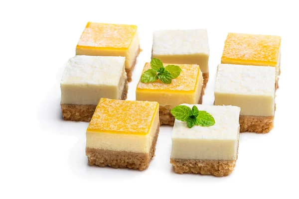 Set of mini lemon and vanilla cheesecake bites isolated on white — 스톡 사진