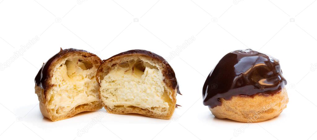 Homemade profiteroles covered with chocolate isolated on white 