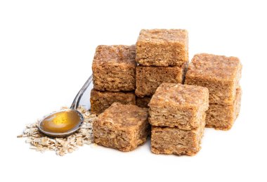 Mini  oat and syrup flapjack slices isolated on white  clipart