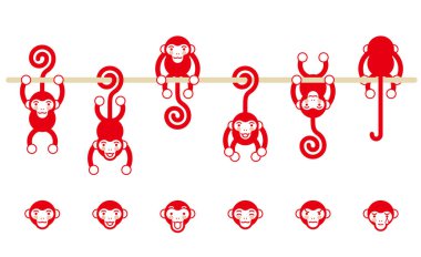 Bir sopa üzerinde asılı bir maymun