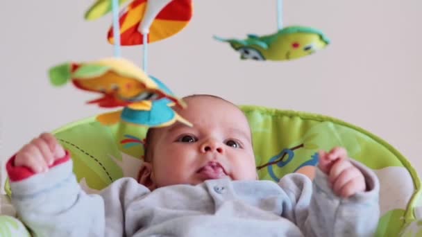 Little cute baby swinging at home — Stock Video