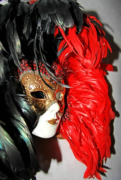 Theatrical mask, black, white and red colors, carnival masque
