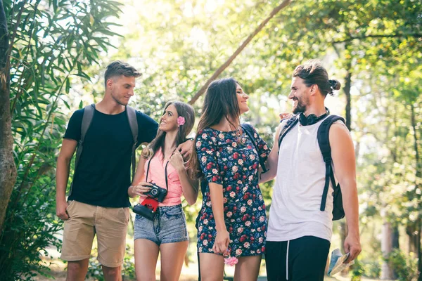 Group of young people having fun in summer park