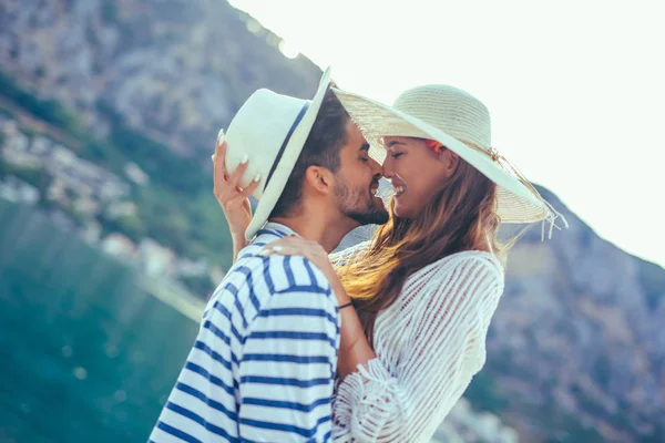 Young cheerful couple by the harbor — Stock Photo, Image