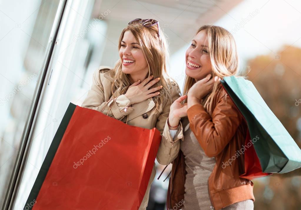 Happy friends shopping.