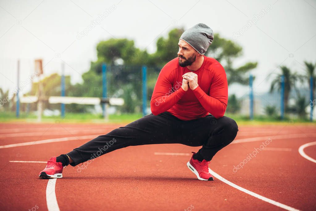 man exercising at race track