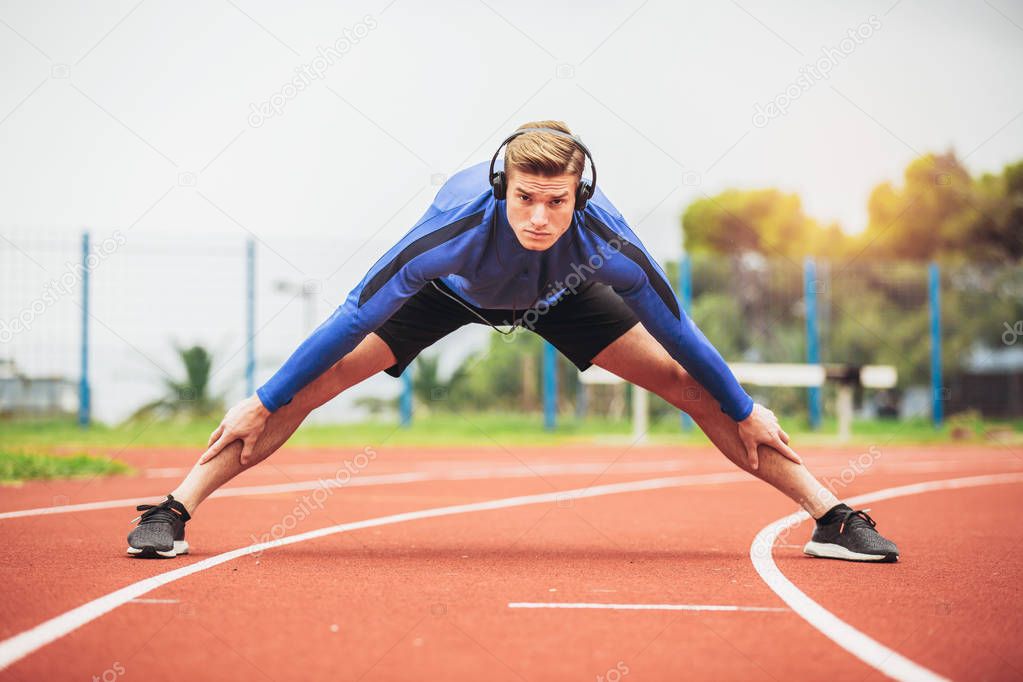 man exercising at race track