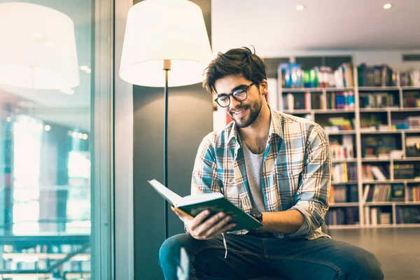 Young Man Reading Book Library — Stock Photo, Image