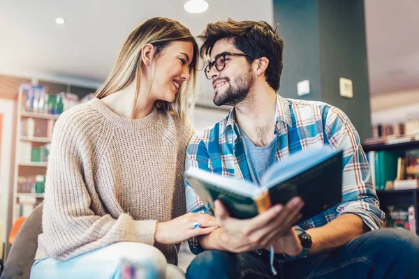 Attractive Young Couple Reading Book Together Library — Stock Photo, Image