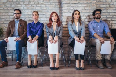 Photo of candidates waiting for a job interview clipart