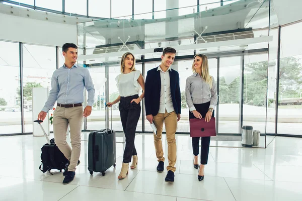 Business people talk and walk together with digital tablet table