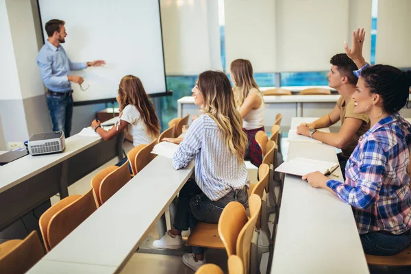 Group of international students and teacher standing at white bo — Stock Photo, Image