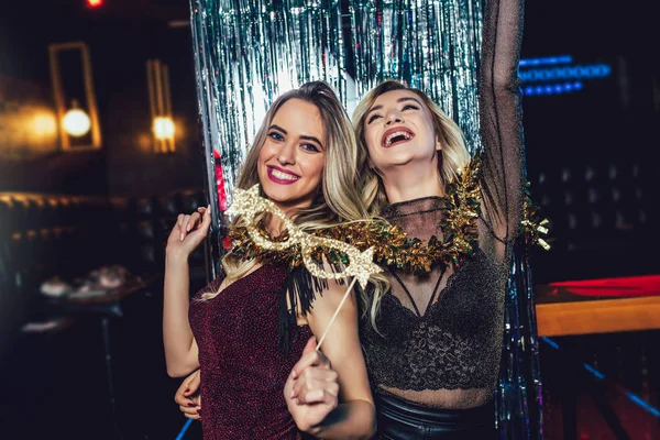 Girls celebrating new years eve at the nightclub. Group of femal