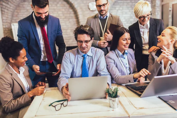 Group of business people working in office and discussing new id — Stock Photo, Image