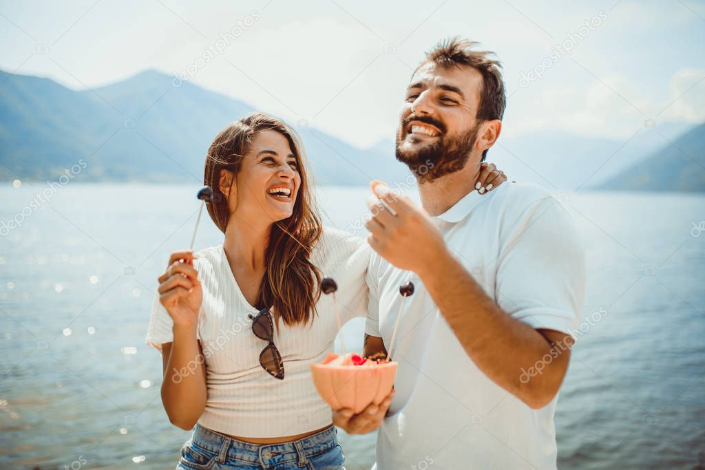  Couple having fun together at the beach