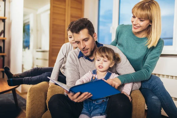 Happy Family Reading Book Home Having Fun — Stock Photo, Image