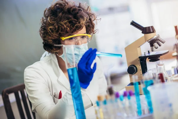 Young Attractive Female Scientist Protective Eyeglasses Gloves Using Test Tube — Stock Photo, Image
