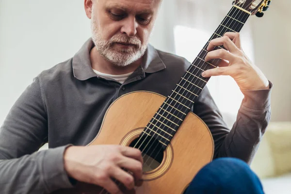 Handsome Mature Man Casual Clothes Smiling While Playing Guitar Home — Stock Photo, Image