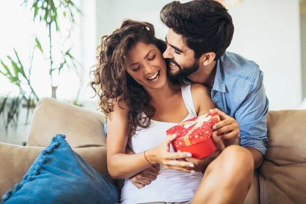 Smiling Man Surprises His Girlfriend Present Home — Stock Photo, Image