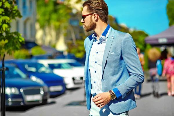 High fashion look.Young stylish confident happy handsome businessman model in suit clothes walking in the street in sunglasses — Stock Photo, Image