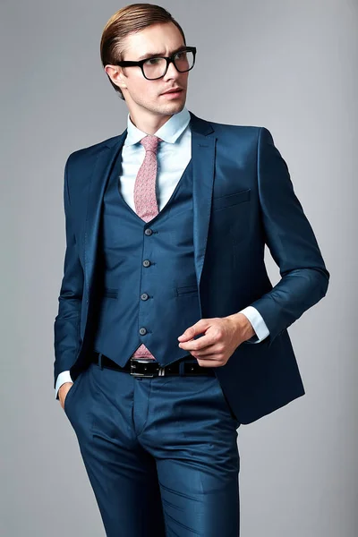 Handsome businessman male model in blue suit  posing in studio — Stock Photo, Image