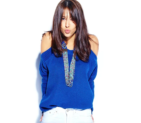 Beautiful smiling hipster brunette woman model pulling stylish summer blue sweater isolated on white background — Stock Photo, Image