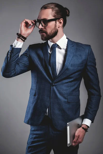 handsome fashion businessman  model dressed in elegant blue suit