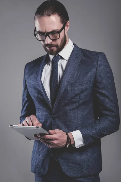 Handsome fashion businessman  model dressed in elegant blue suit — Stock Photo, Image