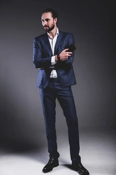 handsome fashion stylish hipster businessman model dressed in elegant blue suit