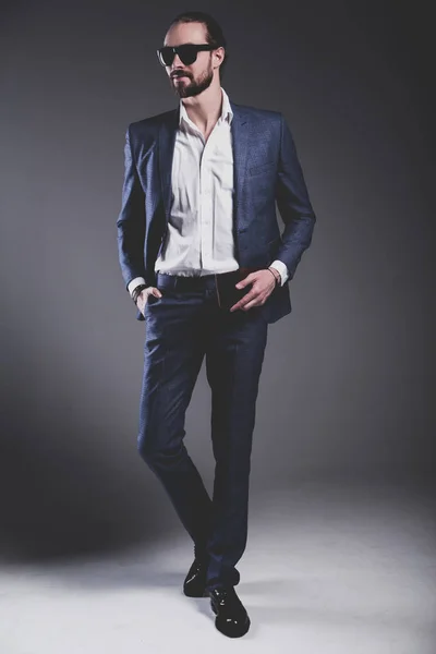Handsome fashion stylish hipster businessman model dressed in elegant blue suit — Stock Photo, Image