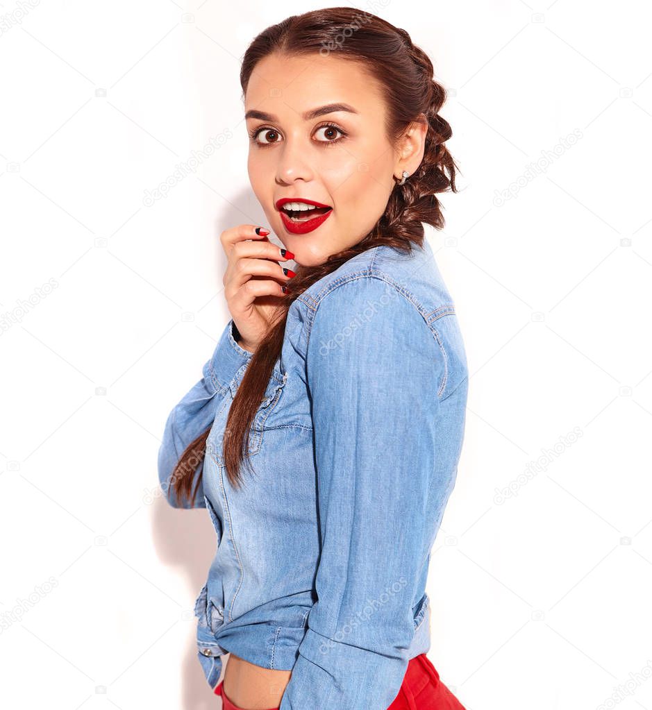 Portrait of young happy smiling woman model with bright makeup and red lips with two horns  in summer blue jeans clothes isolated on white. Going crazy