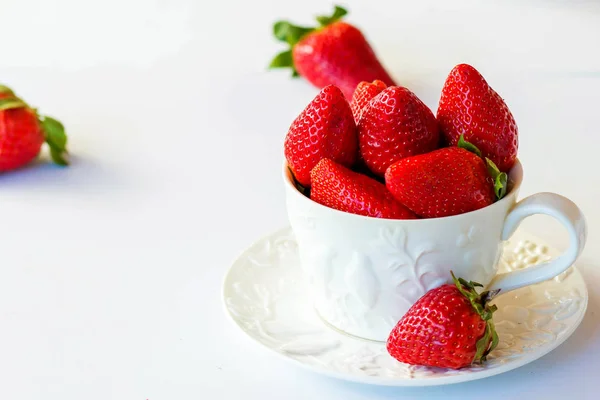 Strawberry in a cup on a white background — Stock Photo, Image