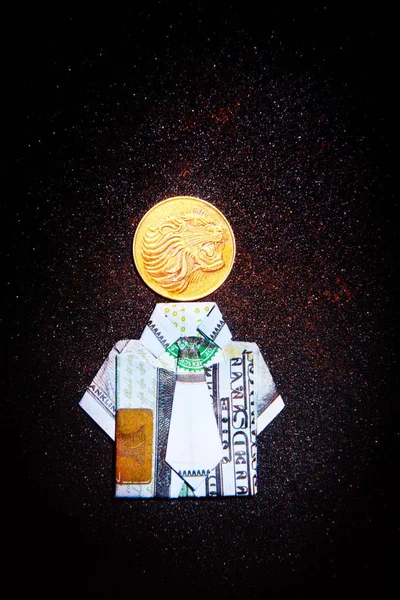 美元折纸黄金狮子硬币沥青背景 — 图库照片