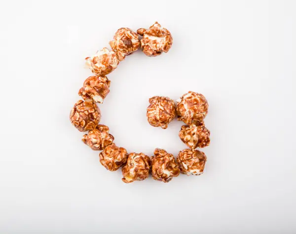 Karamell Popcorn Alphabet Weißer Hintergrund — Stockfoto
