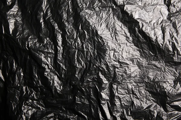 black garbage package shine background