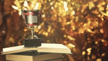 Altın kupa kitap rüzgar tozu HD görüntüleri 