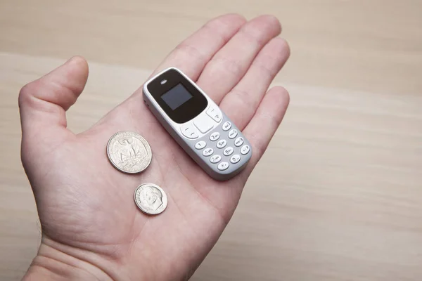 Mobile Phone Coin Hand Table Background — Stock Photo, Image