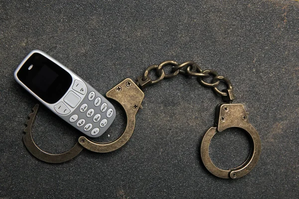 Mobile Phone Handcuffs Asphalt Background — Stock Photo, Image
