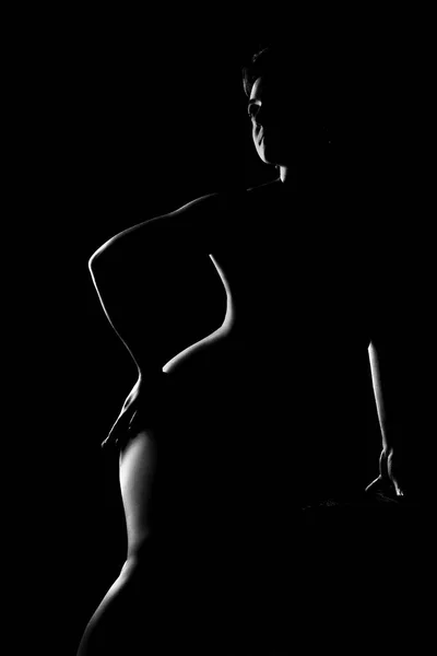 Černé a bílé ženské tělo v zadní světlo umělecké fotografie — Stock fotografie