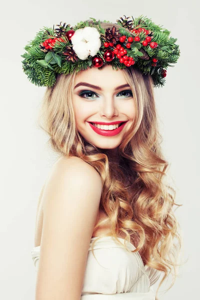 Happy Model Woman with Christmas Wreath. Beautiful Woman with Bl