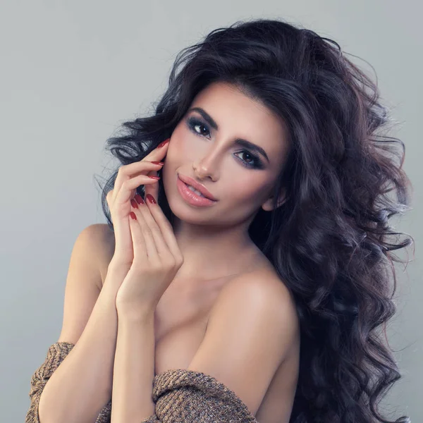 Beautiful Brunette Woman with Curly Hairstyle and Makeup. Beauti