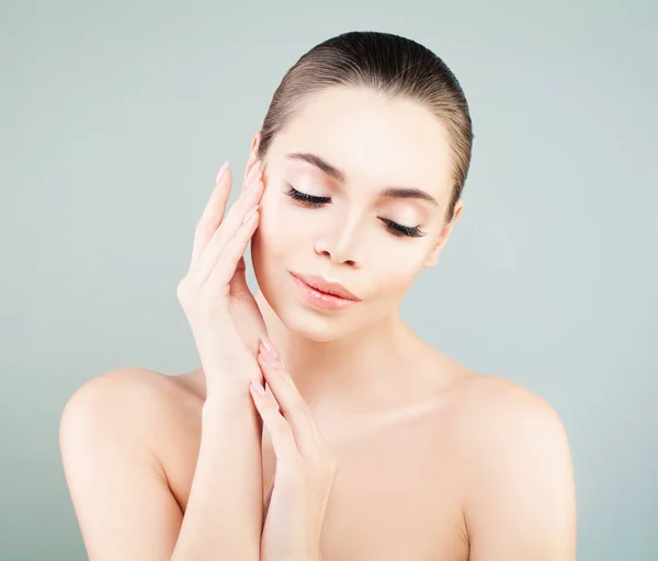 Spa Model Woman with Healthy Skin touching her Hand her Skin.