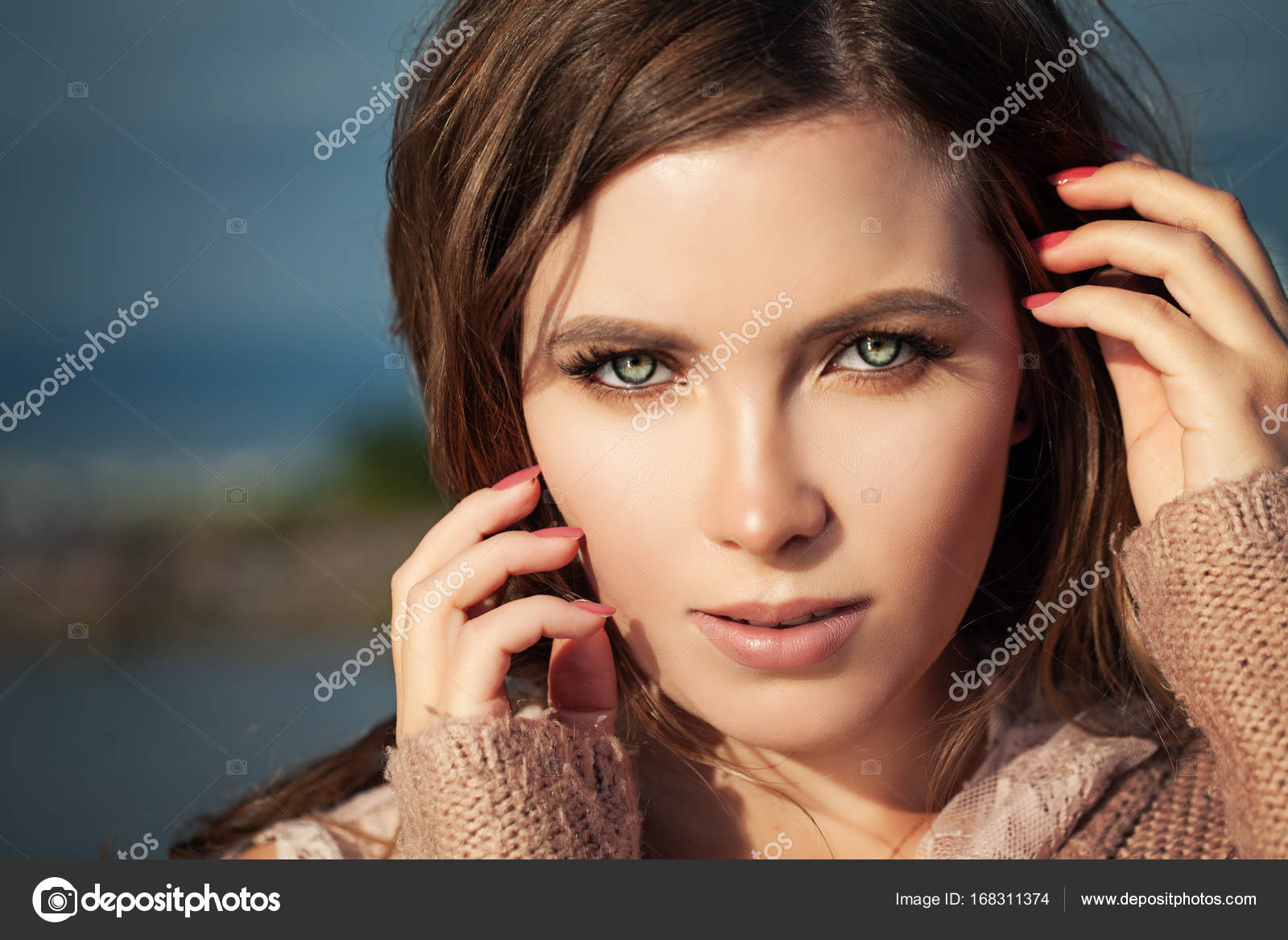 Beautiful Female Face Closeup. Woman with Natural Makeup Outdoor Stock