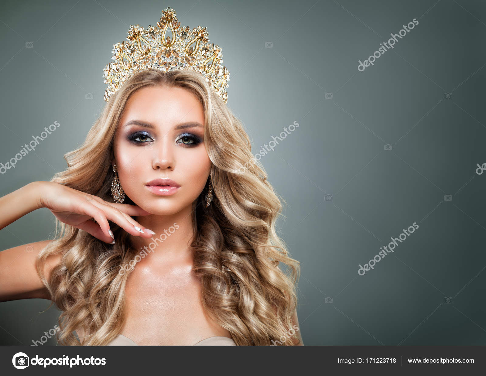 Glamorous Blonde Woman With Golden Crown Makeup And Wavy Hair