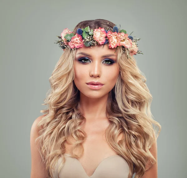 Perfect Blonde Woman with Makeup and Roses Flowers