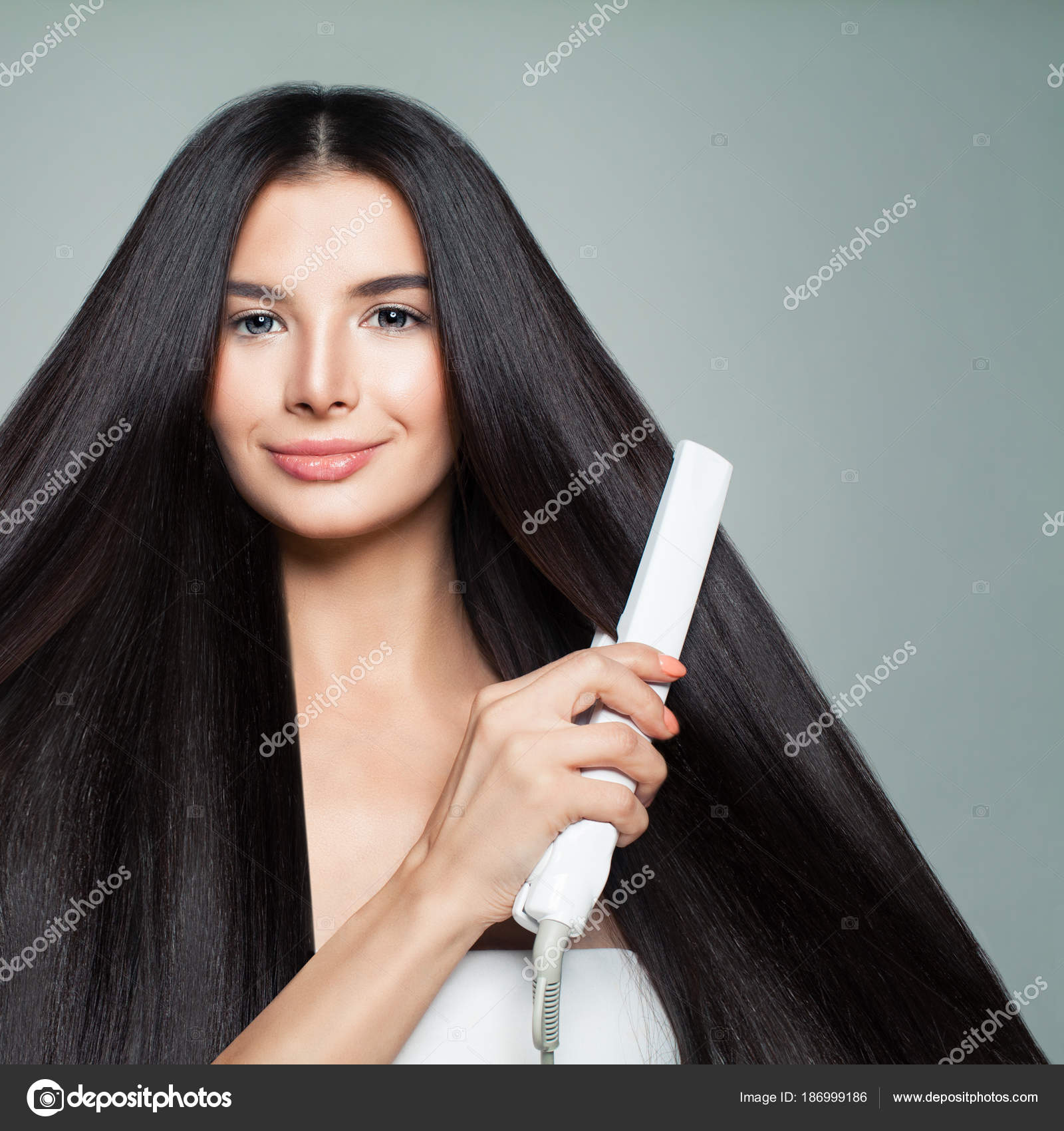 Hairdressing Woman With Beautiful Long Straight Hair Using